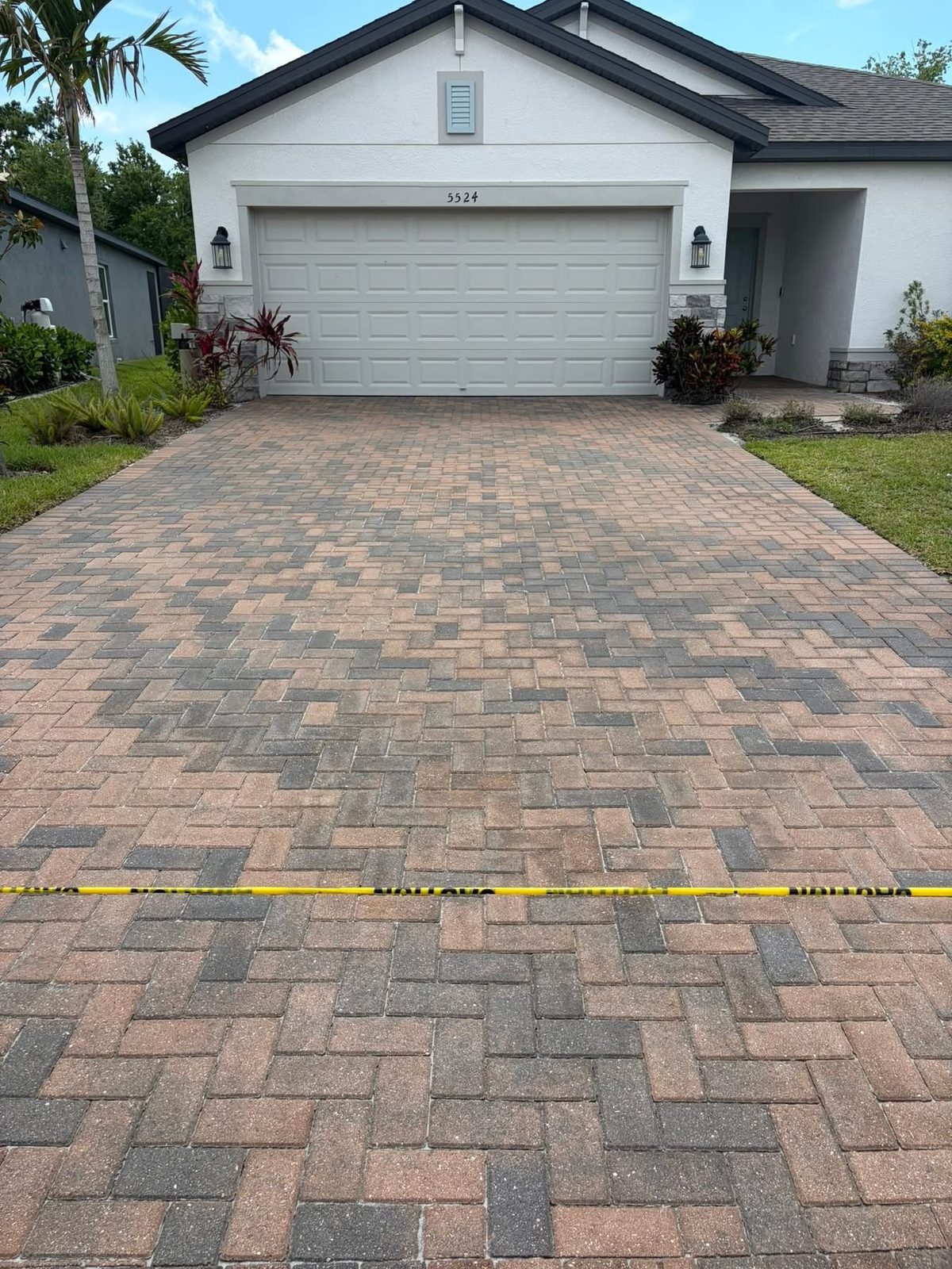 Paver driveway after cleaning and color-enhancing seal