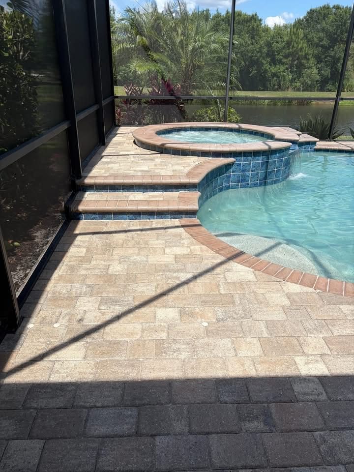 Pool deck and spa surround after cleaning, bright warm stone