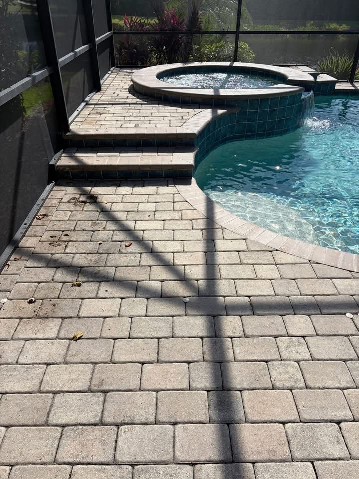 The same pool deck before cleaning, dull and grey