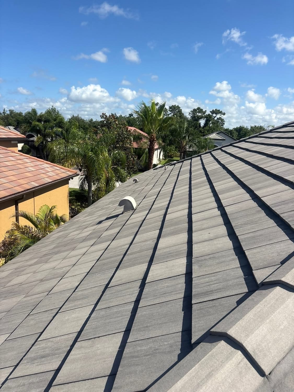 Tile roof after soft washing, uniform clean grey